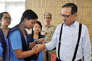 The Students of VKV School, Itanagar  tying �Rakhi� to the Governor of Arunachal Pradesh Shri JP Rajkhowa  on the occasion of Raksha  Bandhan at Raj Bhavan on 18th August�2016.